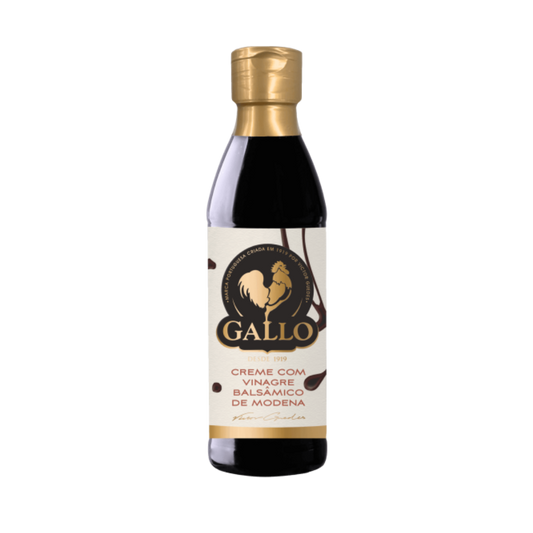 A bottle of Gallo Creamy Balsamic Vinegar with a label that shows the brand name and 'Creamy balsamic vinegar of Modena'. The bottle has a dark tint and a gold-colored cap.